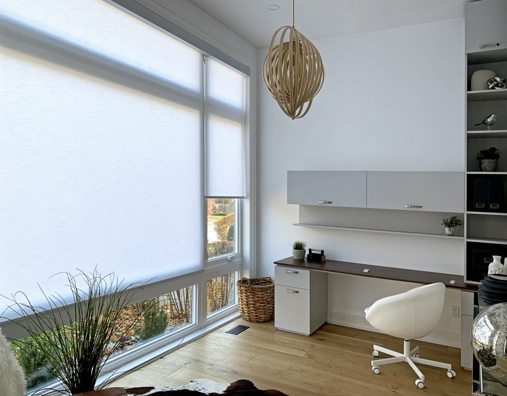 Home office with light-filtering shades
