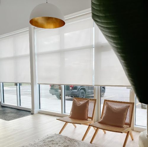 Roller shades in a bright living space
