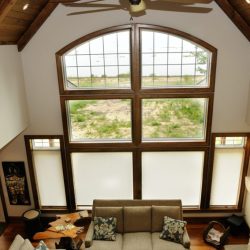 Beige roller shades for cottage livingroom