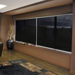 Black sunscreen roller shades for office